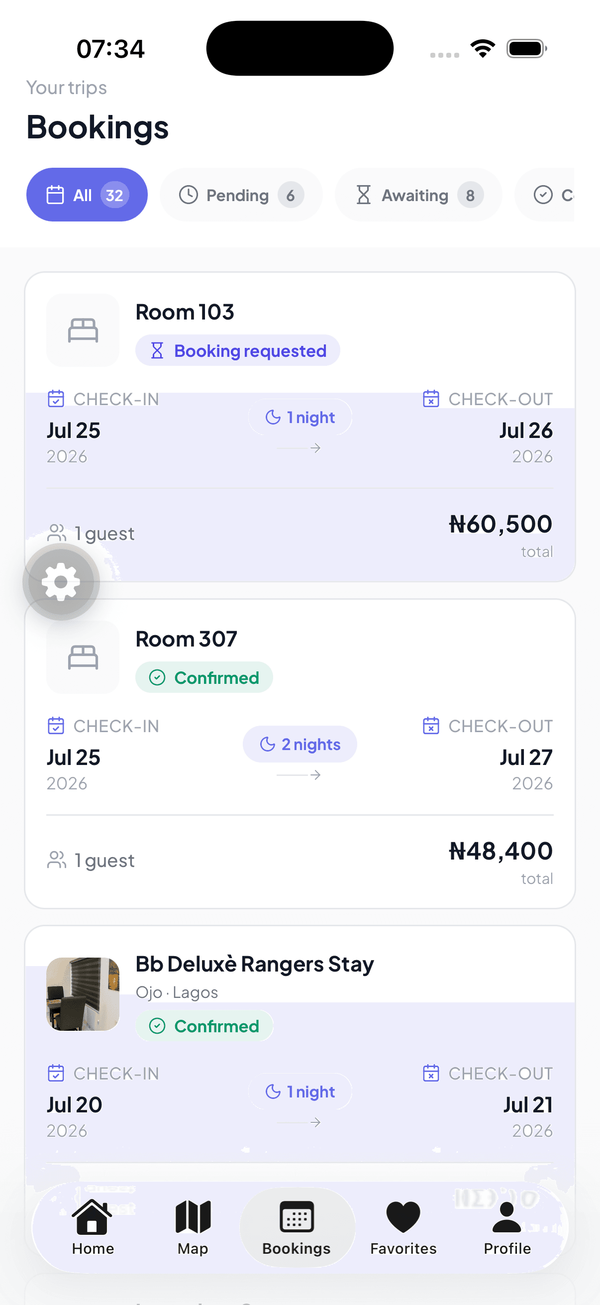 Roomly app bookings list filtered by status, showing requested and confirmed stays with check-in and check-out dates and totals